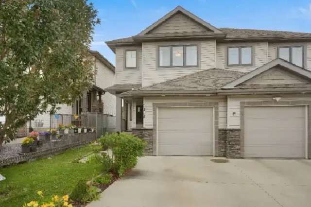 Stunning two-story half duplex with LEGAL BASEMENT Suite!