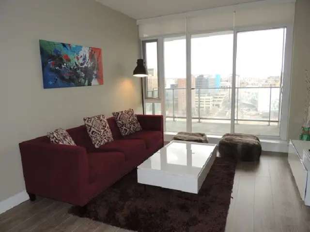 Stunning fully-furnished corner one-bedroom condo